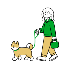 犬と散歩中の女の子の画像